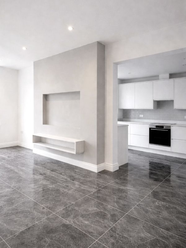 Innenausbau mit Wohnzimmer und offener Küche mit Fliesenboden nach Renovierung in Ingolstadt von Renovierung & Sanierung ALBAN